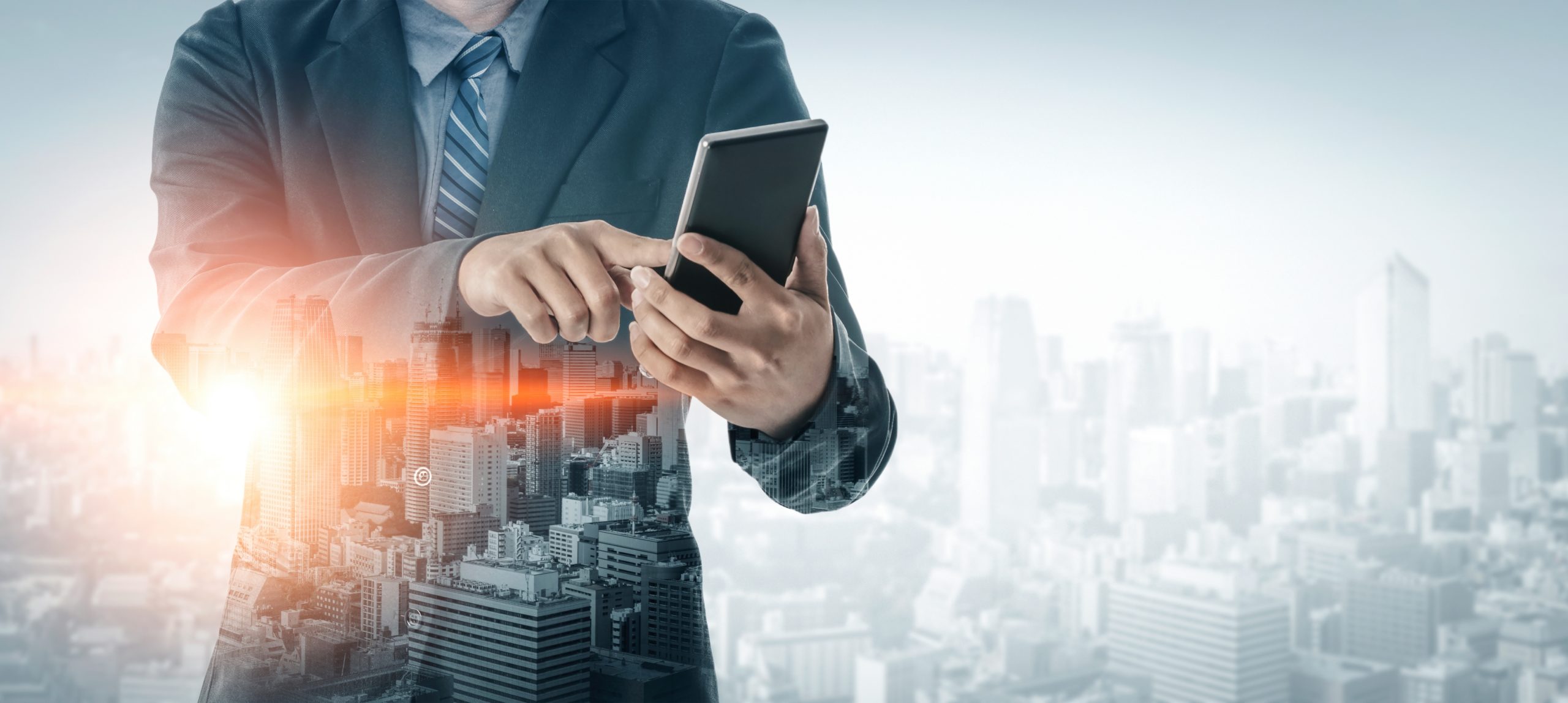 Double Exposure Image of Business Communication Network Technology Concept - Business people using smartphone or mobile phone device on modern cityscape background.